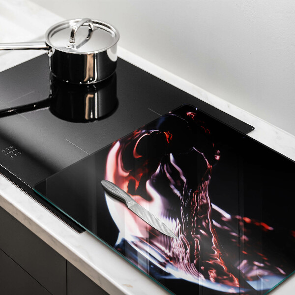 Cache plaque de cuisson Un verre de vin rouge