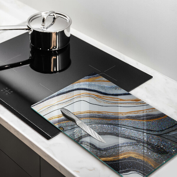 Protège plaque de cuisson rocher avec de l'or