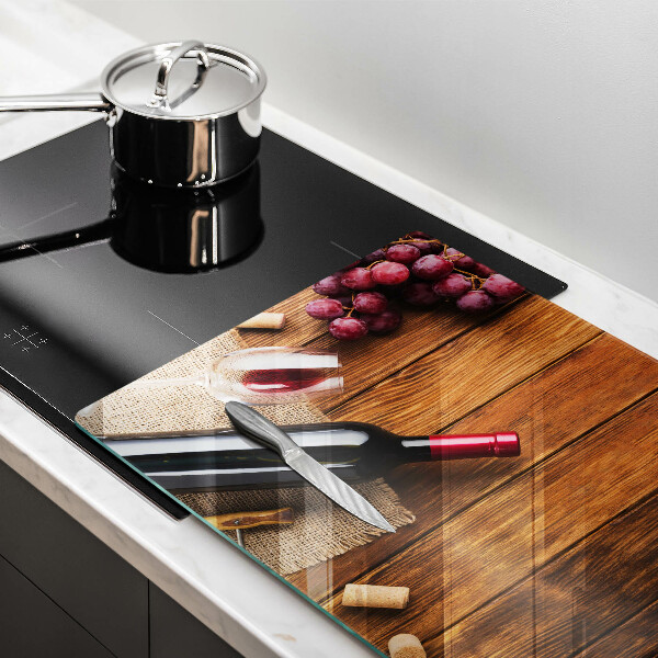 Protège plaque de cuisson Une bouteille de vin rouge