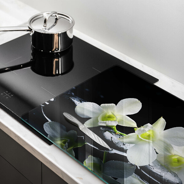 Protection plaque induction Fleurs blanches dans une eau zen