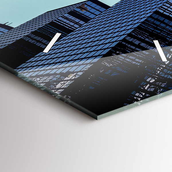 Horloge rectangulaire verticale Avion au-dessus des bâtiments