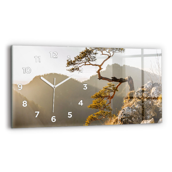 Horloge rectangulaire horizontale Un arbre dans les montagnes