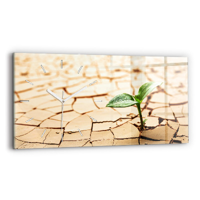 Horloge rectangulaire horizontale Une plante dans un sol asséché