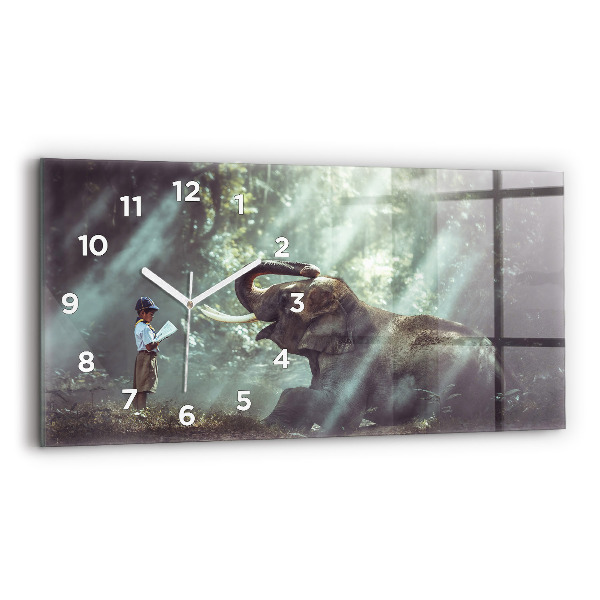 Horloge murale horizontale Un garçon lit un livre