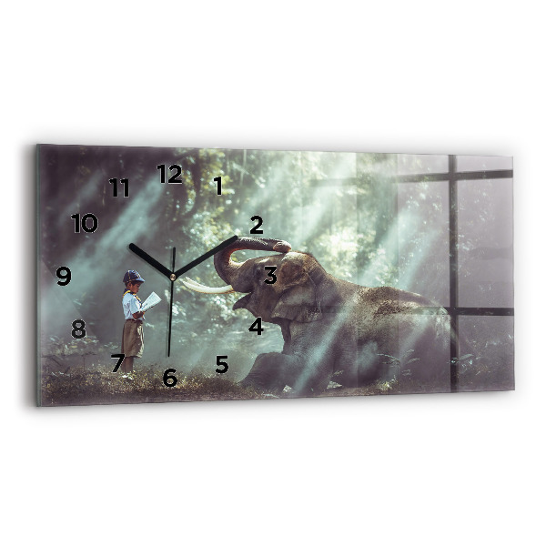 Horloge murale horizontale Un garçon lit un livre