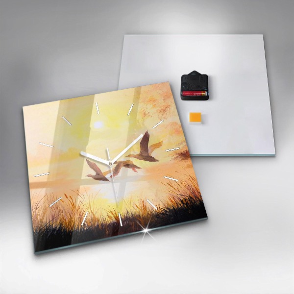 Pendule carrée en verre Grues au coucher du soleil