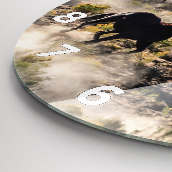 Horloge ronde Un troupeau de chevaux au galop