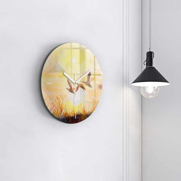 Pendule murale ronde Grues au coucher du soleil