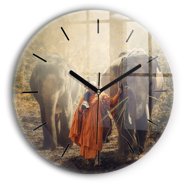 Horloge ronde Moine conduisant des éléphants