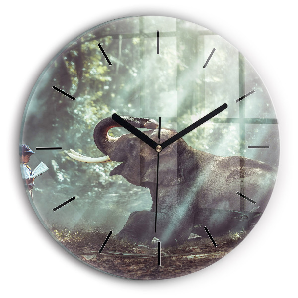 Horloge ronde Un garçon lit un livre