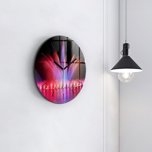 Horloge ronde Fontaine de Wroclaw la nuit