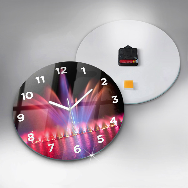 Horloge ronde Fontaine de Wroclaw la nuit