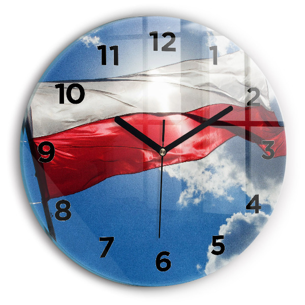 Horloge ronde Le drapeau polonais contre le ciel