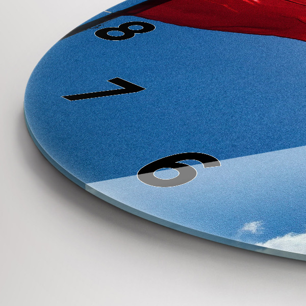 Horloge ronde Le drapeau polonais contre le ciel