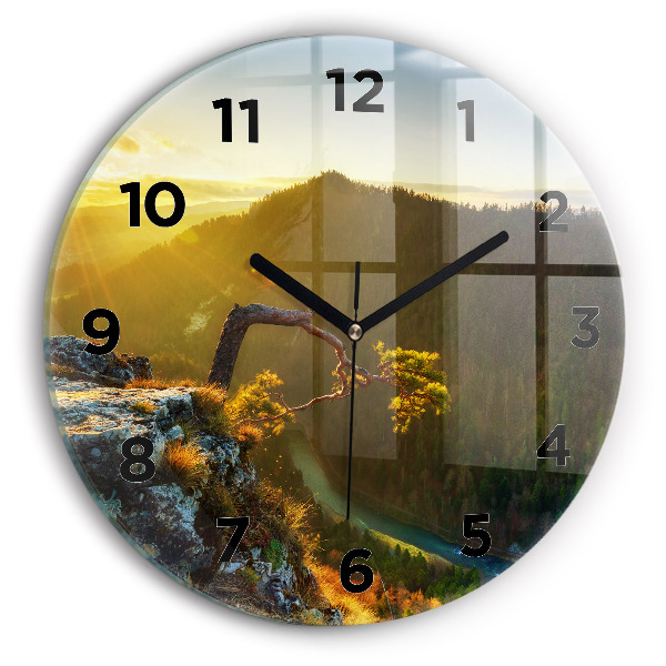Pendule murale ronde Coucher de soleil sur les montagnes