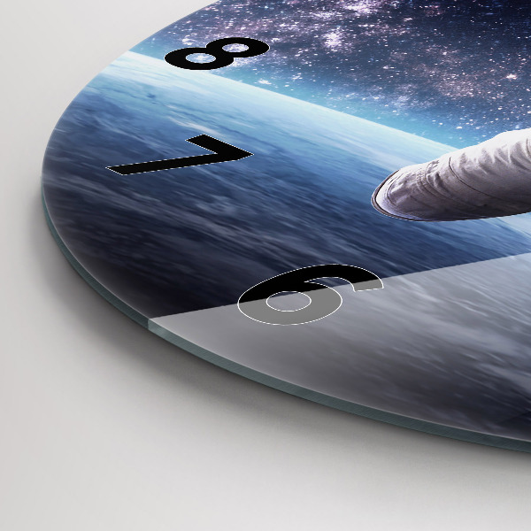 Pendule murale ronde Astronaute au-dessus de la Terre